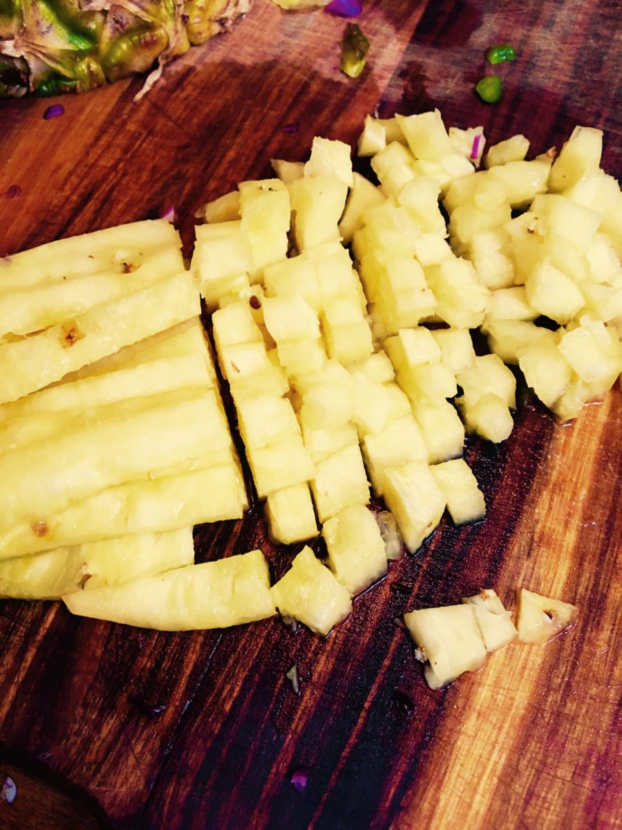 Dicing pineapple for Pineapple salsa. Vying For Veganism.