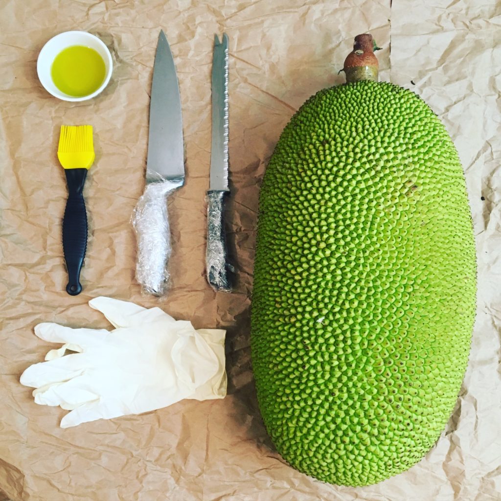 Setting up for the task. Jackfruit, wrapped knives, oil, gloves and surface paper. Vying for Veganism